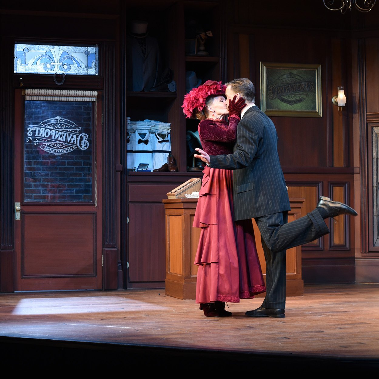 Two actors embracing on a stage